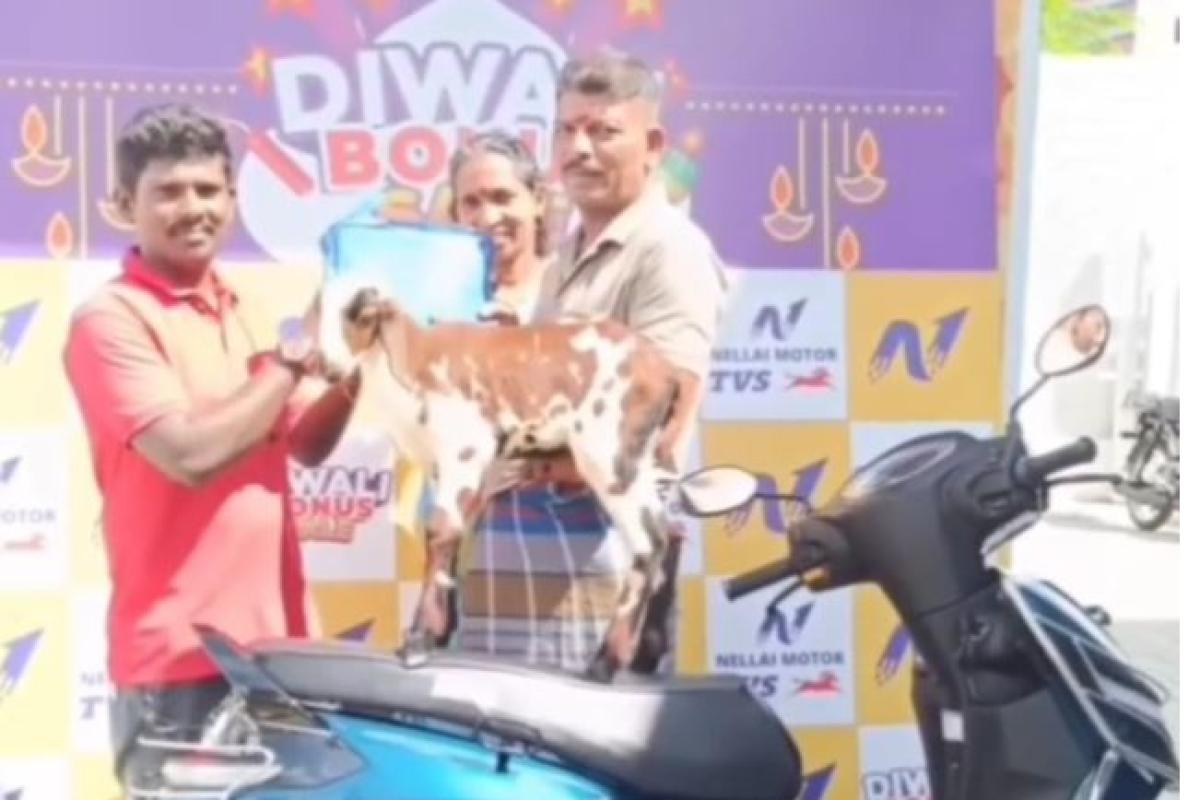farmer-comes-to-buy-bike-with-affectionate-lamb-in-nellai