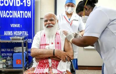 ec-asks-health-ministry-to-remove-pm-modi-photo-from-vaccine-centres