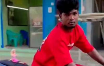 a-young-man-rides-a-bike-with-his-doll-girlfriend-in-vetiyaanvilai