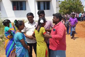 student-writing-exam-in-grief-over-father-s-death-sister-hugs-him-and-cries